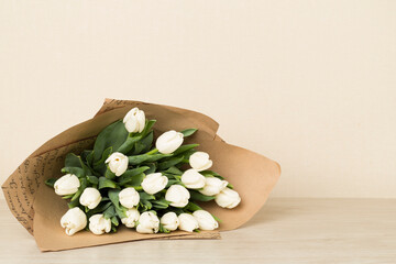 White tulip bouquet on table