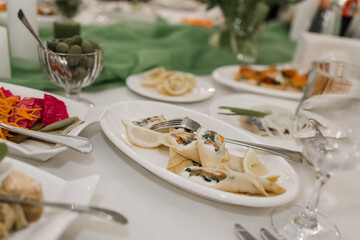 pancakes with salmon fish on a plate on a table in a restaurant