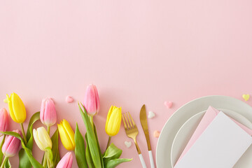 Happy Mother's Day concept. Flat lay photo of circle plate cutlery knife fork postcard yellow pink tulips and hearts baubles on isolated pastel pink background with empty space