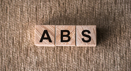Abdominal Back Spine or ABS text on wooden cubes. Medical concept