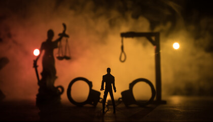 Execution concept. Death penalty electric chair miniature in selective focus inside old prison. Old...