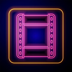 Glowing neon Play video icon isolated on black background. Film strip sign. Vector