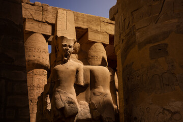 Ancient statue of Ramesse II in Karnak temple, Luxor, Egypt. Travel concept.