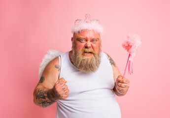 Fat angry man with tattoos acts like a magical fairy