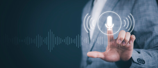 Business people Hand touch the microphone button on virtual screen. Blog speak talk advertising presentation, Voice recognition, speech detection and deep learning application, Voice Assistance
