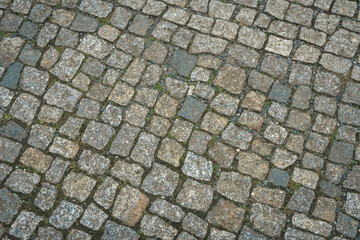 Old stone paved pavement background.