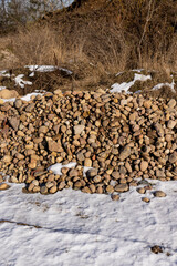 a pile of stones collected after clearing the field for sowing