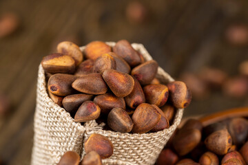 a bunch of pine nuts in the shell