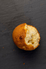 Obraz na płótnie Canvas Soft and fresh fragrant wheat cupcake on a black stone