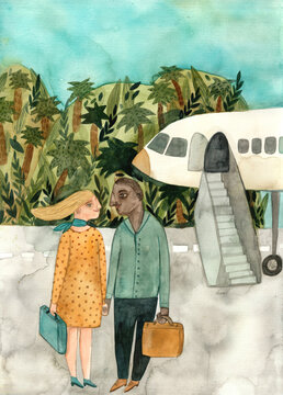 A couple standing in front of an airplane