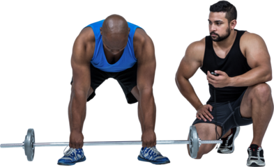 Man lifting barbell with trainer
