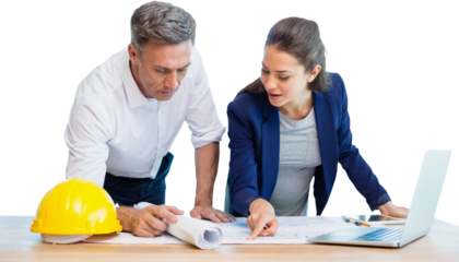 Female architect explaining blueprint to colleague