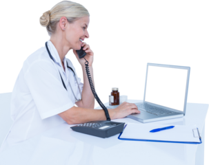 Smiling doctor using laptop while talking on telephone