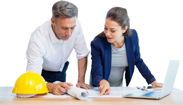 Female architect explaining blueprint to colleague