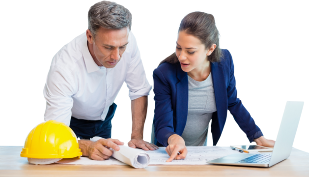 Female architect explaining blueprint to colleague