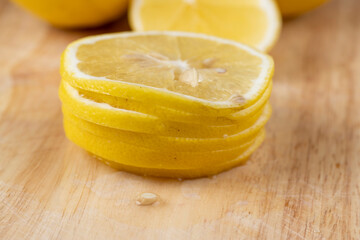 Yellow ripe lemon cut into slices