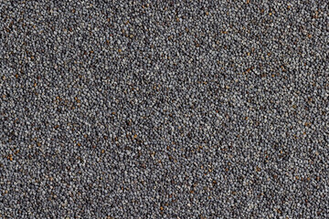 Poppy seeds on the table close up