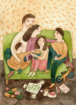 A family sitting on a green sofa 