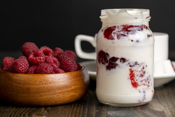 Fresh milk yogurt with whole fresh raspberries