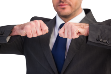 Mid section of a businessman with clenched fist