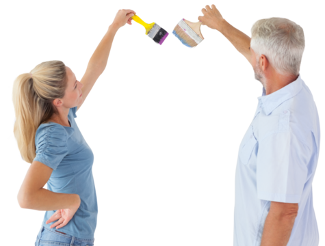 Side view of couple with paint brush