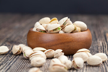 peeled pistachio nuts close-up on the table