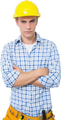 Serious handyman in yellow hard hat with arms crossed