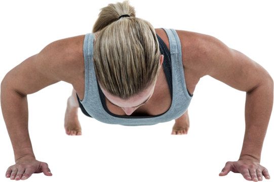 Muscular woman doing push-ups
