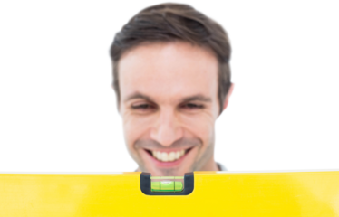 Repairman looking at spirit level