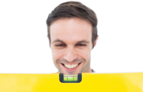 Repairman looking at spirit level