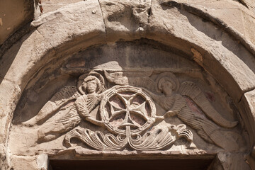 Stone carvings with cross. Exterior details of Jvari Monastery. Georgia