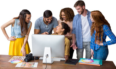 Cheerful usiness people discussing over computer at table