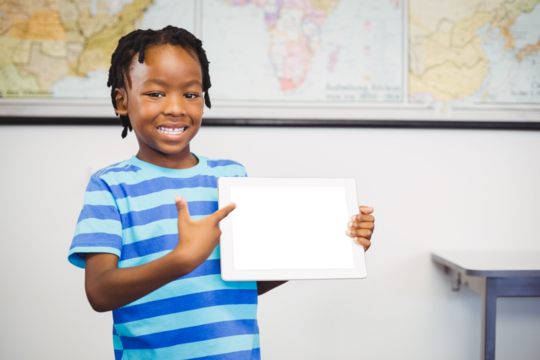 Portrait of boy pointing over digital tablet