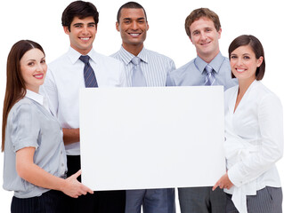 Smiling business people holding blank cardboard against white background