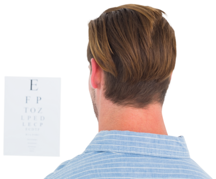 Focused man in suit on eye test letters