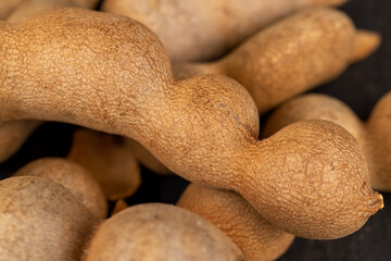 long ripe tamarind pods close up