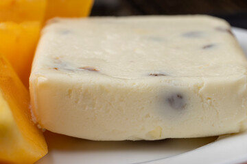 soft curd cheese with raisins and persimmons
