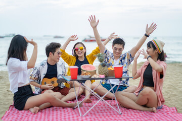 Attractive friends traveler sing and dance while camping at seaside enjoy holiday vacation trip in...