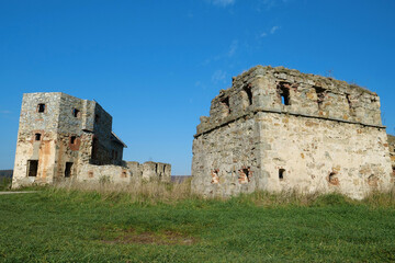 Fototapeta na wymiar Ancient stone towers in Pniv Castle - medieval historical object, Ukraine