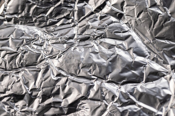old used crumpled aluminum foil , close up