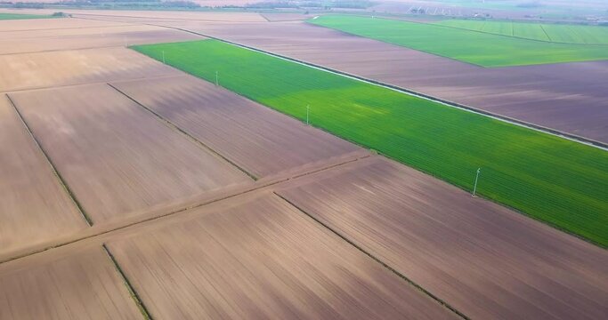 Green and gray fields seen from above