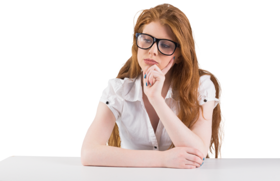 Pretty redhead thinking and looking down