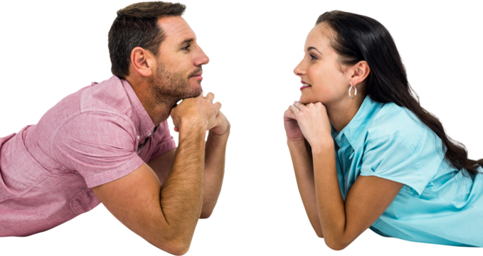 Happy couple laying on floor looking at each other