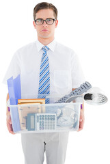 Fired businessman holding box of belongings