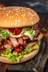 delicious homemade burgers of beef, cheese and vegetables on a wooden board, Hamburger. Fast food concept