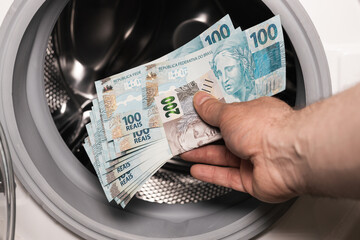 Brazilian money in the washing machine, Concept, Money laundering, Illegal business, Black market...