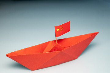 Paper red ship with China flag, China pacific fleet concept, Middle country sea shipping, Water transportation