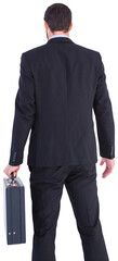 Rear view of businessman holding a briefcase
