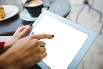 Woman pointing at digital tablet