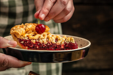 Delicious Homemade Cherry Pie, Flaky Crust, piece on a plate and the whole homemade cherry pie, top view